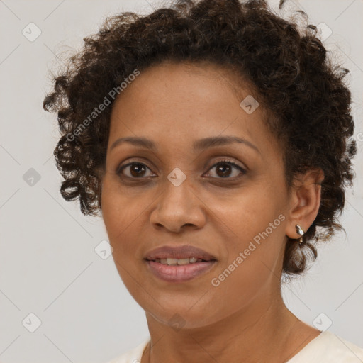 Joyful black adult female with short  brown hair and brown eyes
