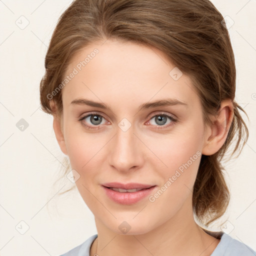 Joyful white young-adult female with medium  brown hair and blue eyes