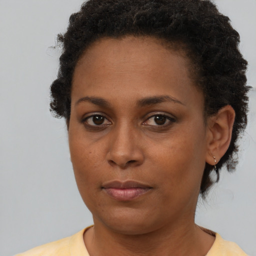 Neutral black young-adult female with short  brown hair and brown eyes