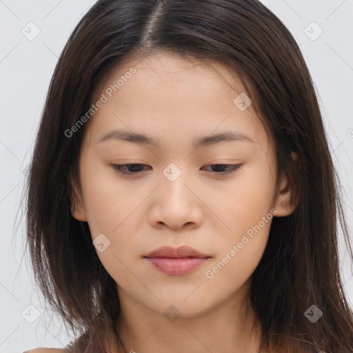 Joyful asian young-adult female with long  brown hair and brown eyes