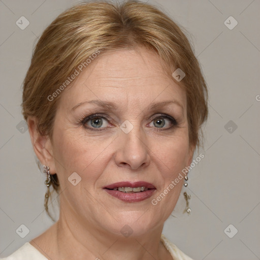 Joyful white adult female with medium  brown hair and blue eyes