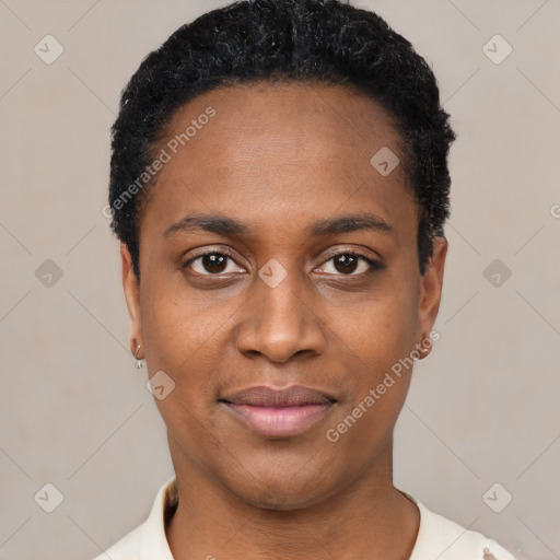 Joyful black young-adult female with short  black hair and brown eyes