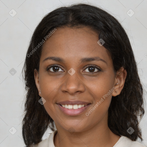 Joyful black young-adult female with medium  brown hair and brown eyes