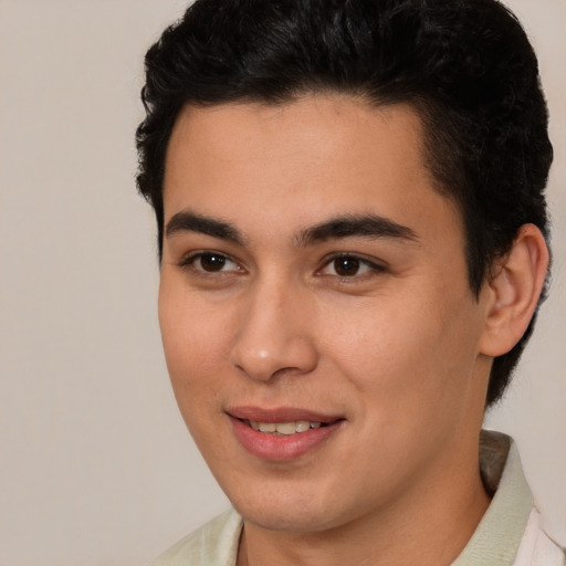 Joyful latino young-adult male with short  brown hair and brown eyes