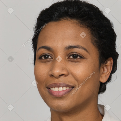 Joyful latino young-adult female with short  black hair and brown eyes