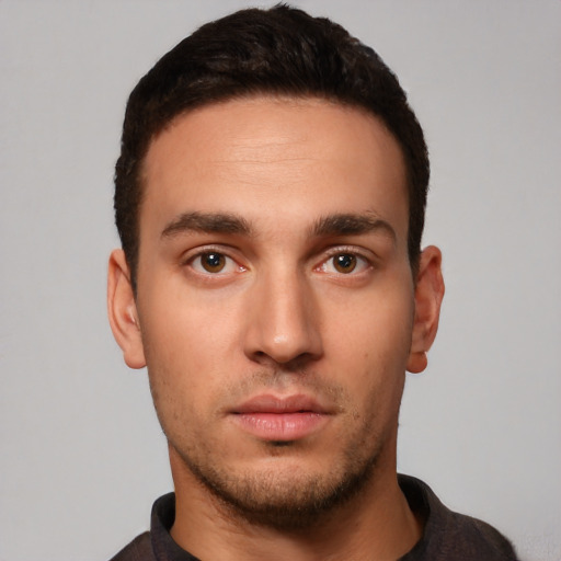 Neutral white young-adult male with short  black hair and brown eyes