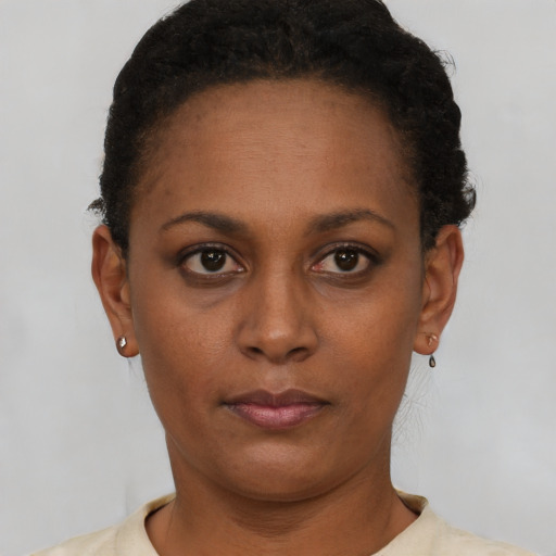Neutral black young-adult female with short  black hair and brown eyes