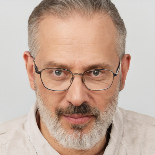 Joyful white middle-aged male with short  gray hair and brown eyes