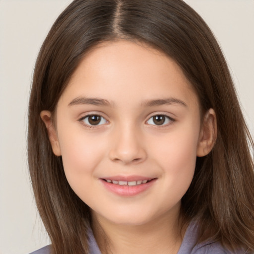 Joyful white child female with long  brown hair and brown eyes