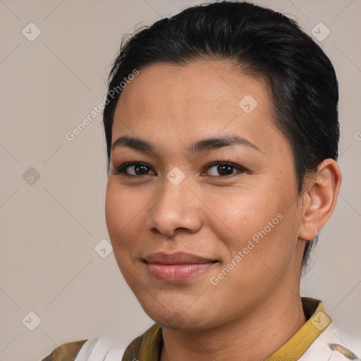 Joyful latino young-adult female with medium  brown hair and brown eyes