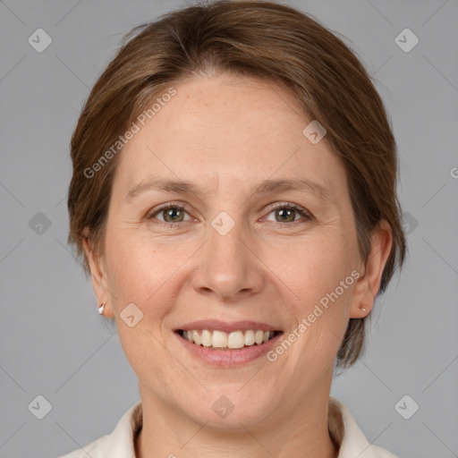 Joyful white adult female with medium  brown hair and grey eyes