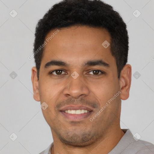 Joyful latino young-adult male with short  brown hair and brown eyes