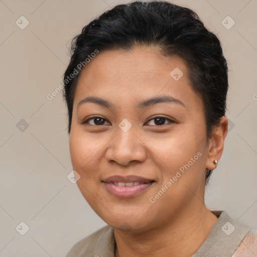 Joyful asian young-adult female with short  brown hair and brown eyes