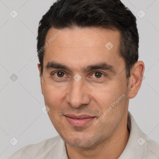 Joyful white adult male with short  brown hair and brown eyes