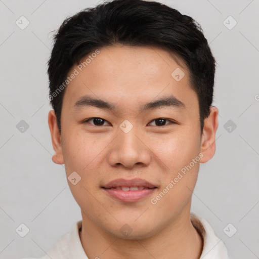 Joyful asian young-adult male with short  brown hair and brown eyes