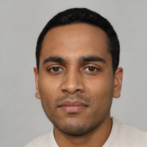 Neutral latino young-adult male with short  black hair and brown eyes