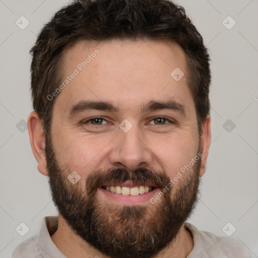 Joyful white adult male with short  brown hair and brown eyes