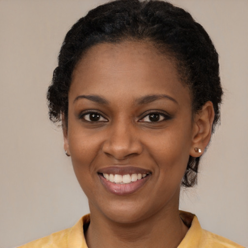Joyful latino young-adult female with medium  black hair and brown eyes