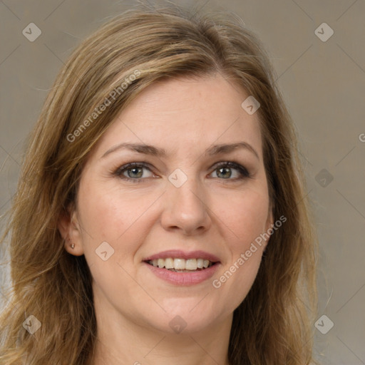 Joyful white young-adult female with long  brown hair and green eyes