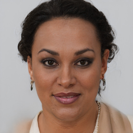 Joyful latino young-adult female with short  brown hair and brown eyes