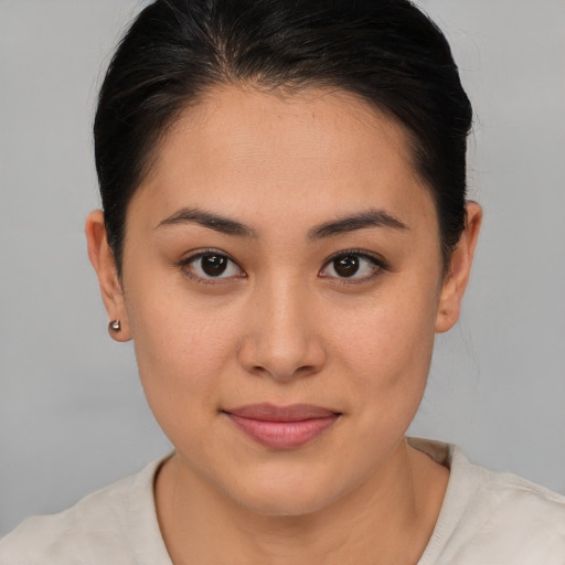 Joyful asian young-adult female with short  brown hair and brown eyes