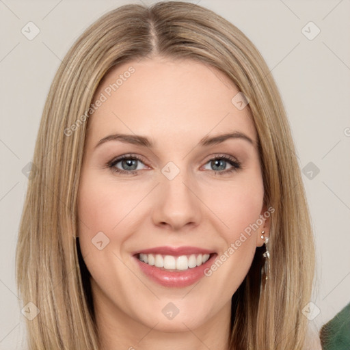 Joyful white young-adult female with long  brown hair and green eyes