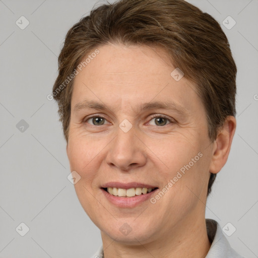 Joyful white adult female with short  brown hair and brown eyes