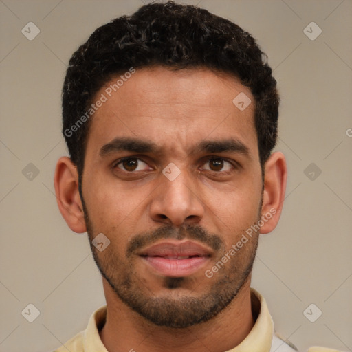 Neutral white young-adult male with short  black hair and brown eyes