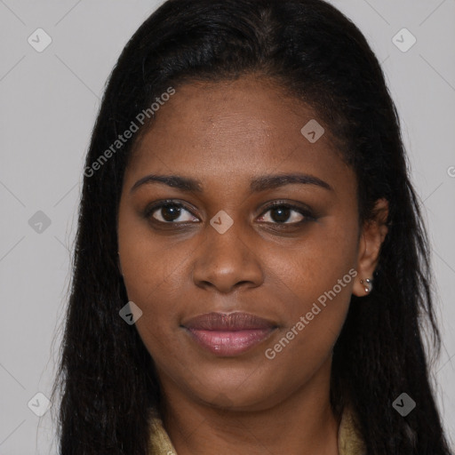 Joyful black young-adult female with long  brown hair and brown eyes