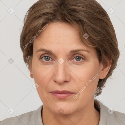 Joyful white adult female with short  brown hair and grey eyes