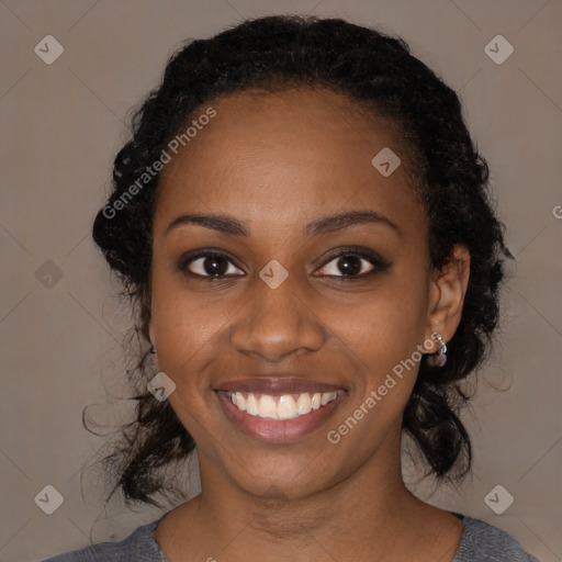 Joyful black young-adult female with medium  black hair and brown eyes