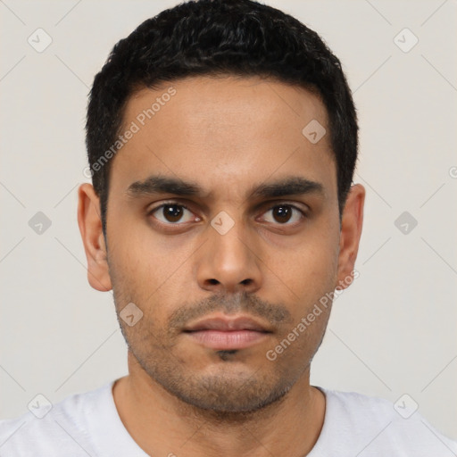 Neutral latino young-adult male with short  black hair and brown eyes