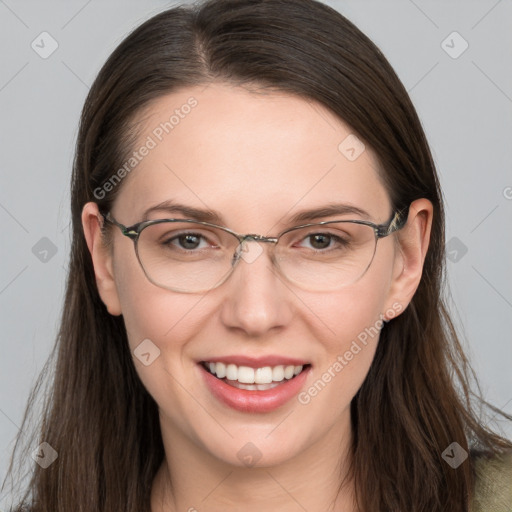 Joyful white adult female with long  brown hair and grey eyes