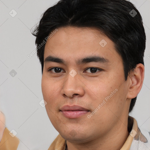 Joyful asian young-adult male with short  black hair and brown eyes