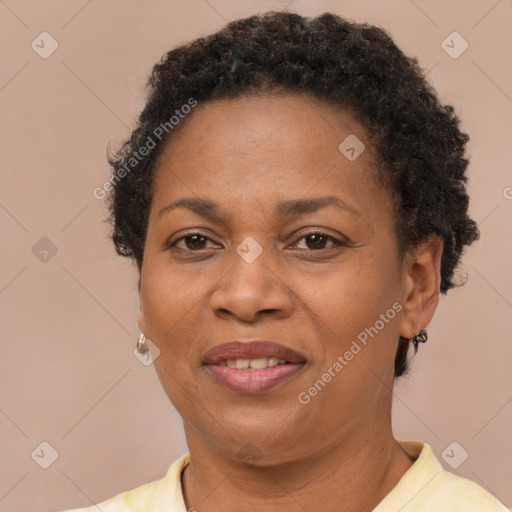 Joyful black adult female with short  brown hair and brown eyes