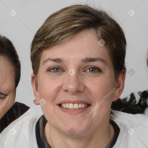 Joyful white adult female with medium  brown hair and blue eyes