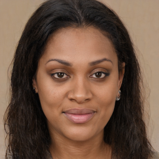 Joyful latino young-adult female with long  brown hair and brown eyes