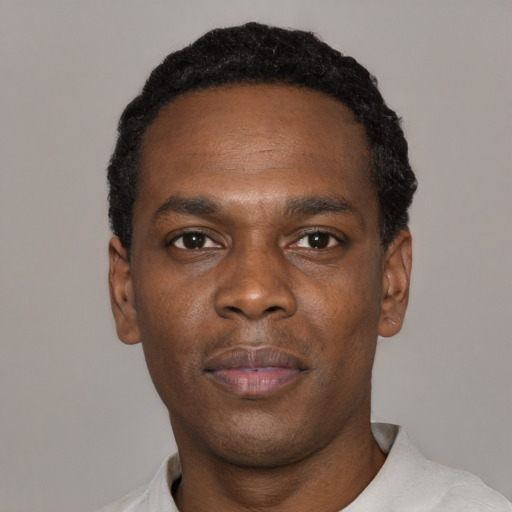 Neutral black young-adult male with short  black hair and brown eyes