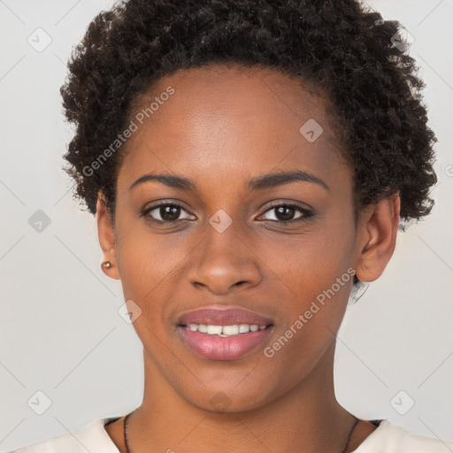 Joyful black young-adult female with short  brown hair and brown eyes