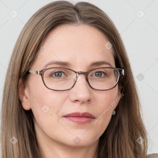 Joyful white adult female with long  brown hair and grey eyes