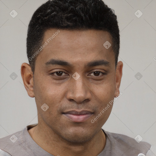 Joyful latino young-adult male with short  black hair and brown eyes