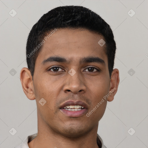 Joyful latino young-adult male with short  black hair and brown eyes