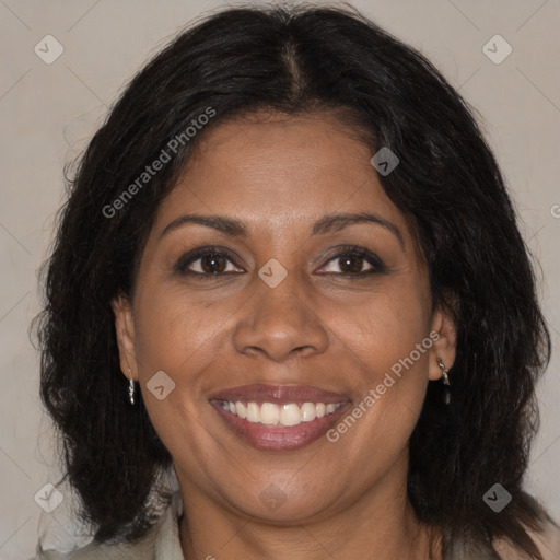 Joyful black adult female with medium  brown hair and brown eyes