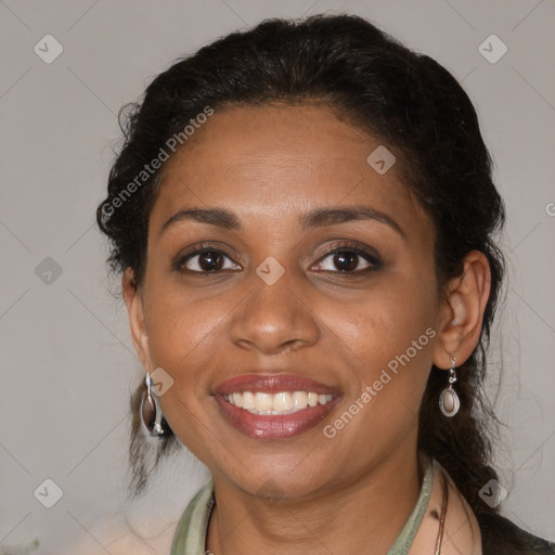 Joyful black adult female with medium  brown hair and brown eyes