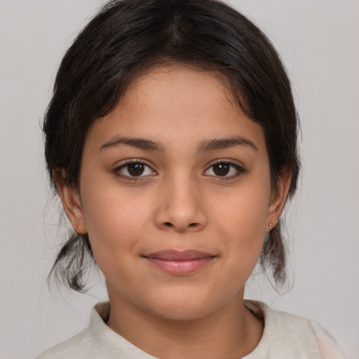 Joyful latino child female with medium  brown hair and brown eyes