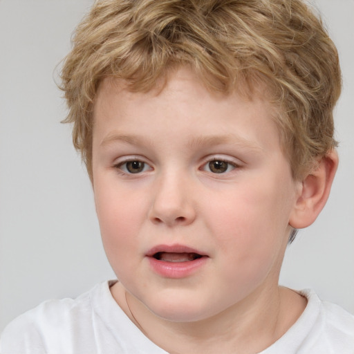 Joyful white child male with short  brown hair and brown eyes