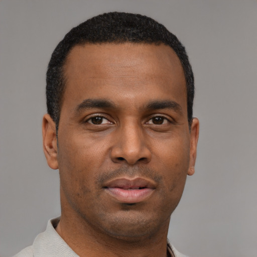 Neutral latino young-adult male with short  brown hair and brown eyes