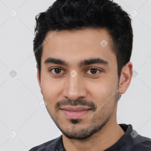 Joyful latino young-adult male with short  black hair and brown eyes