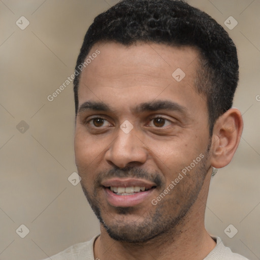 Joyful black young-adult male with short  black hair and brown eyes