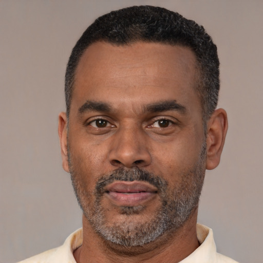 Neutral latino adult male with short  black hair and brown eyes